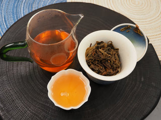 Full tea brewing set featuring 2019 Dayi 8542 raw puerh tea infusion