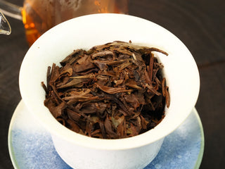 Infused 2020 Fuding White Peony leaves (wet leaf) after multiple steepings, soft brown and fully opened in the gaiwan.