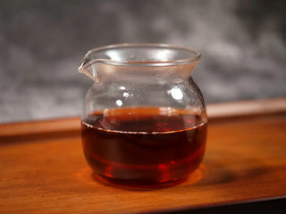 Close-up of vibrant red Pu-erh tea liquor in a glass Gongdao cup from Qilin Hao Fengshan Gushu Ripe Pu-erh Tea Cake 2021