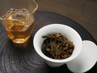 2020 Dazhai Ancient Tree Raw Pu-erh Tea – Golden Amber Tea Liquor Served in White Porcelain Cup, Ready to Drink
