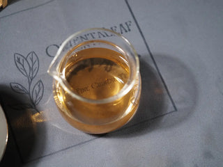 Close-up of second infusion tea liquor from 2018 Dazhai Ancient Tree Raw Pu-erh Tea Cake in gongdao cup