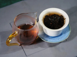 On Taoism (Jingtai Hao) Fucha served in traditional Gongfu style tea cups with glass server.