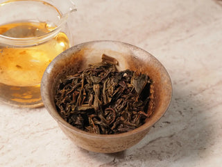 Close-up of steeped tea leaves from Value Classic 2008 Tribute Sheng Pu-erh Tea Cake – 357g Menghai (2019 Pressed) inside the gaiwan