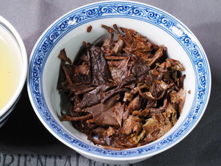Close-up of brewed leaf base of Yunnan High Mountain Wild Ancient Tree Shoumei White Tea (2019) in a gaiwan