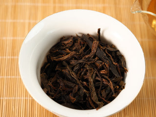 Wet leaves of Jing Chang Hao Mengsong Autumn Harvest 2013 raw Pu-erh in a gaiwan after steeping, opened brown arbor leaf