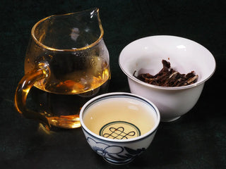 Gaiwan, Gongdao cup, and tasting cup with Yunnan Jinggu White Peony Tea Cake 357g infusion displayed together, highlighting tea ritual presentation