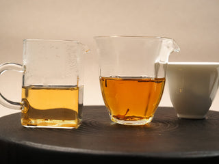 Comparison of first and second steeps of 2014 Fuding White Peony waffle cake, lighter first liquor beside deeper second liquor.