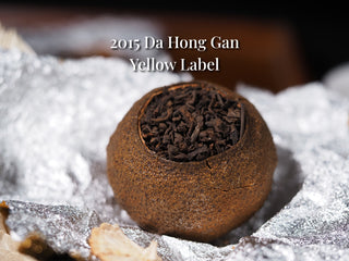 Close-up of the top opening of a Xinhui citrus Pu-erh tea ball, tightly packed with Menghai ripe Pu-erh.