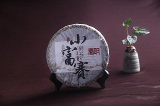 2018 Xiao Hu Sai Sheng Pu-erh Tea Cake, Mengku Raw Tea, showcasing the prominent wrapper design.