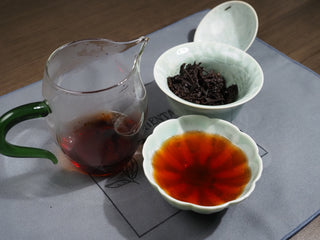 Aged 2006 Dayi 7572 ripe Puerh tea set presentation with gaiwan, pitcher, and tea soup