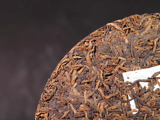 Misty Gold Bud Ripe Pu-erh Tea Cake – Menghai First-Spring-close-up of the tea cake’s front, showing the texture and dense golden buds