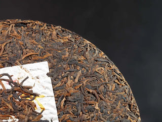 Misty Gold Bud Ripe Pu-erh Tea Cake – Menghai First-Spring-front detail of the tea cake highlighting a different section with tightly packed golden buds