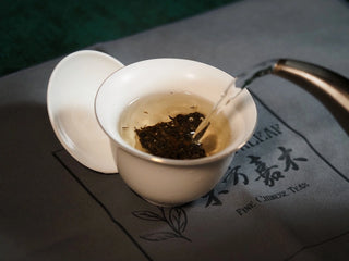 Chang'an Golden Flower Fu Brick Tea Mini Cake – 60g pouring hot water into gaiwan