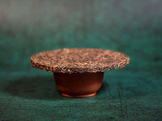 Chang'an Golden Flower Fu Brick Tea Mini Cake – 60g side view showing thin profile and rich color