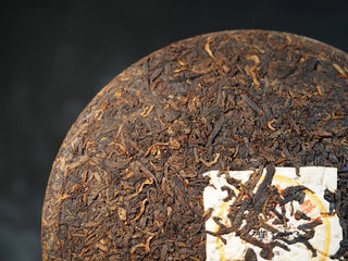 Close-up of the surface texture of Classic 1973 Large 400g Ripe Pu-erh Tea Cake Menghai front