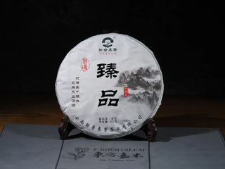 Front view of Hidden Mountain Raw Pu-erh Tea Cake (357g) in original packaging, showcasing small-batch, high-mountain Yunnan ancient tree tea.