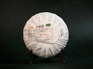Back view of the Spring Ming Large 400g Menghai Ripe Pu-erh Tea Cake – 2020 paper wrapping with clear label and storage details.
