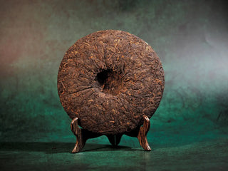 Bare back side of Spring Ming Large 400g Menghai Ripe Pu-erh Tea Cake – 2020 revealing the leaf texture and rich dark tone.